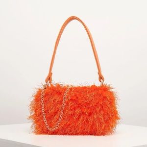 Orange fringe bag
